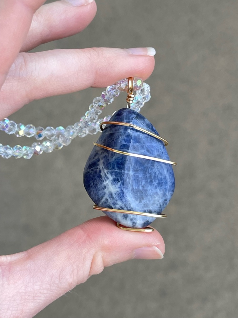 Blue Sodalite Gold Tone wire wrapped pendant with White AB Glass Beads